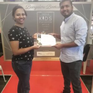 Rashmita receiving certificate