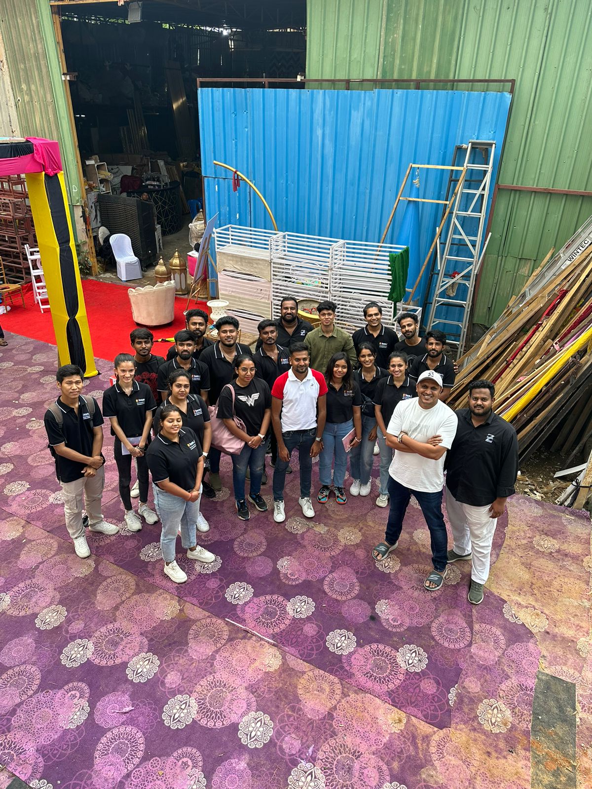 team I students in branded polo shirts on a production set