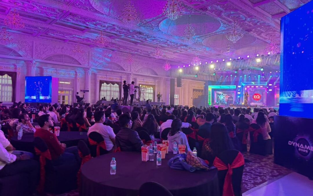Packed live show with stage lights and LED screens at a ballroom venue in Bengaluru
