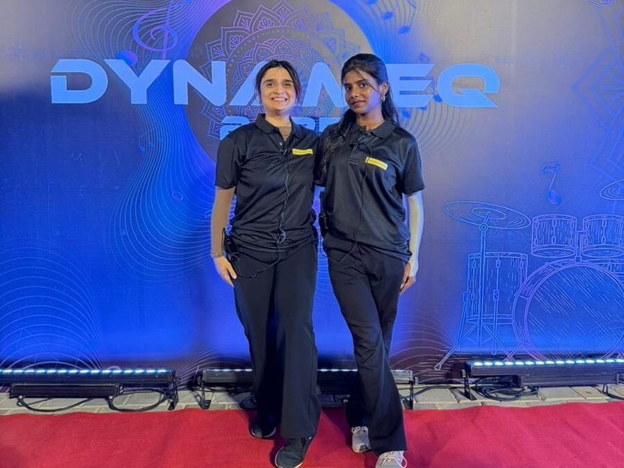 Two team I students in crew uniform at a live show, the kind of real event work that leads to placements